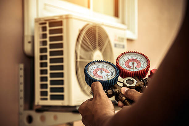 Professional Air Conditioning Service technician working in Fairview, OR